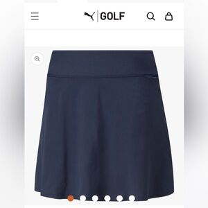 Navy blue golf skort 18”, size XS. Never worn. 50+ UPF.